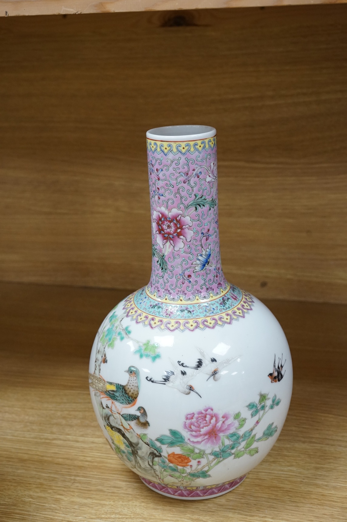 A Chinese famille rose vase, mid 20th century and a Chinese blue and white ‘boys’ dish, c.1900, vase 33cm high